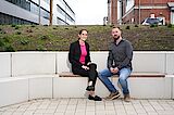 What speaks for us are our employees 2 colleagues sitting on a bench