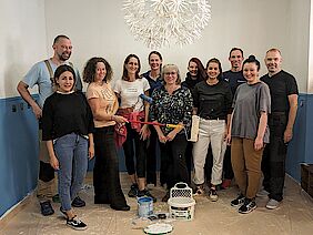 Social Day volunteers Eleven young men and women with paint, brushes and rollers